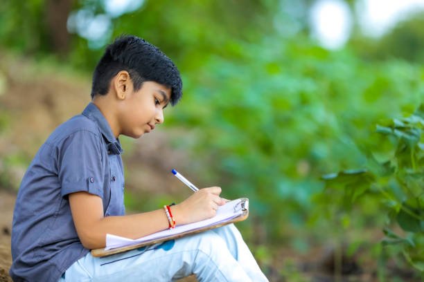 Kid writing a journal entry to express thoughts and improve writing skills